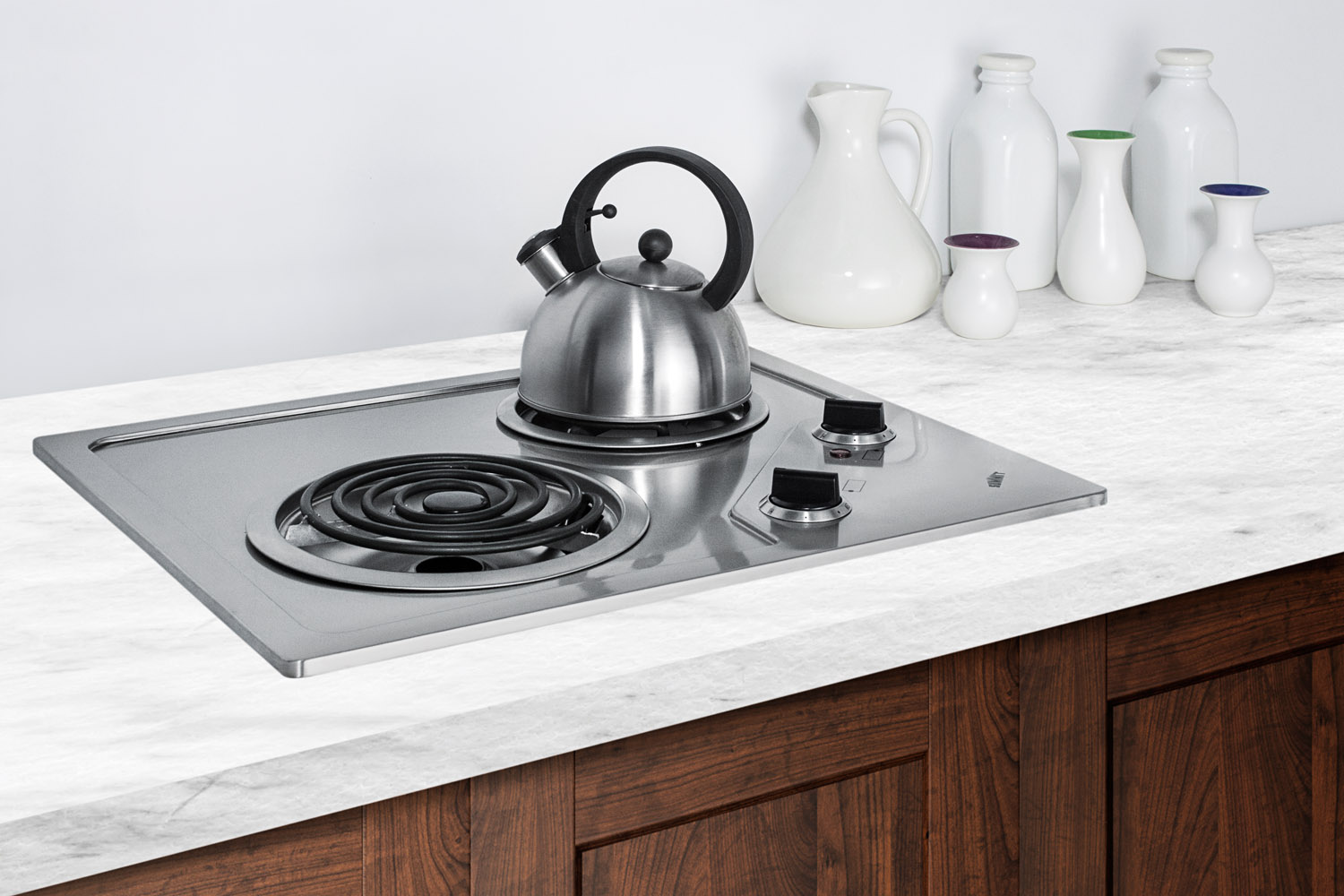 2-burner 230V electric cooktop designed for portrait or landscape installation, with coil elements and stainless steel finish